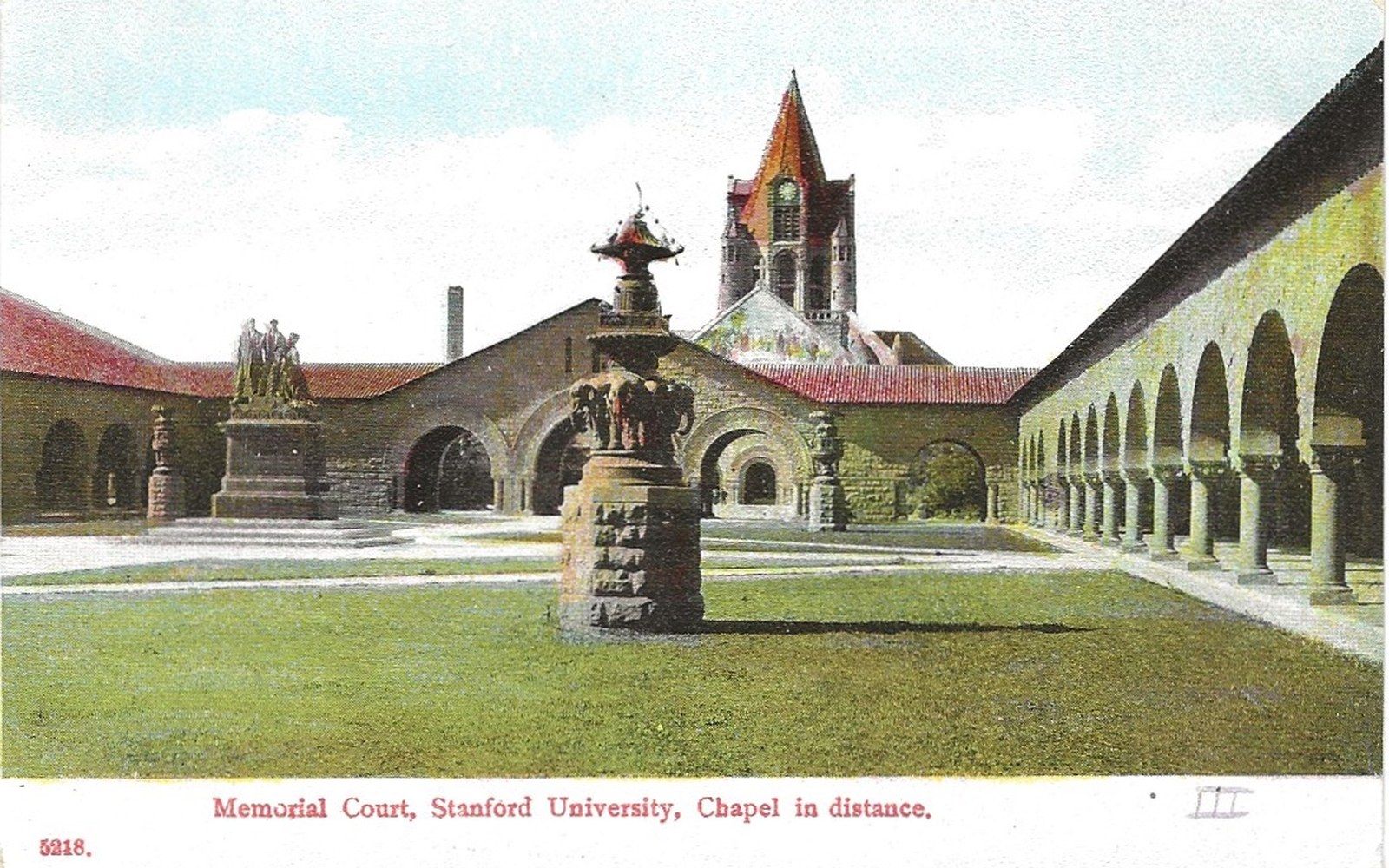 Vintage postcard of Memorial Court at Stanford University with the chapel tower rising behind arched arcades